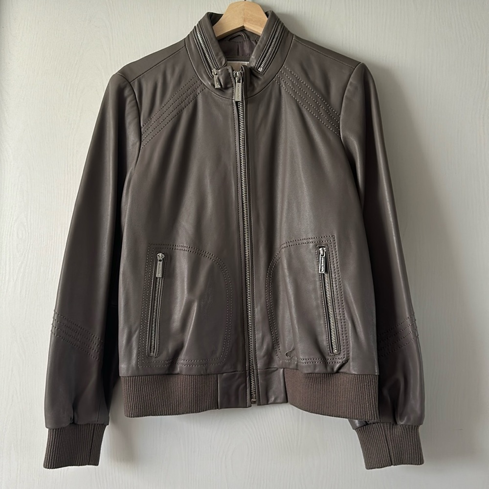 Women’s Michael Kors size L Gray leather jacket.